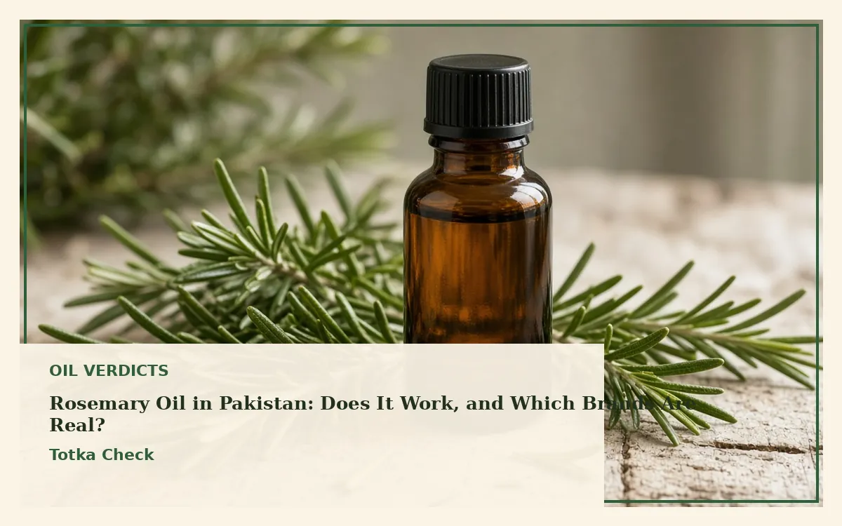 Fresh rosemary sprigs and an amber bottle of rosemary oil