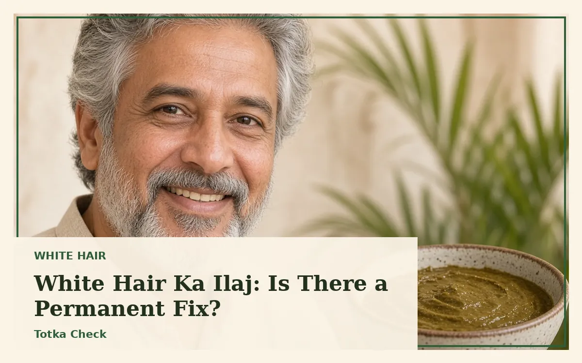 Smiling Pakistani man with grey hair and beard beside a bowl of henna